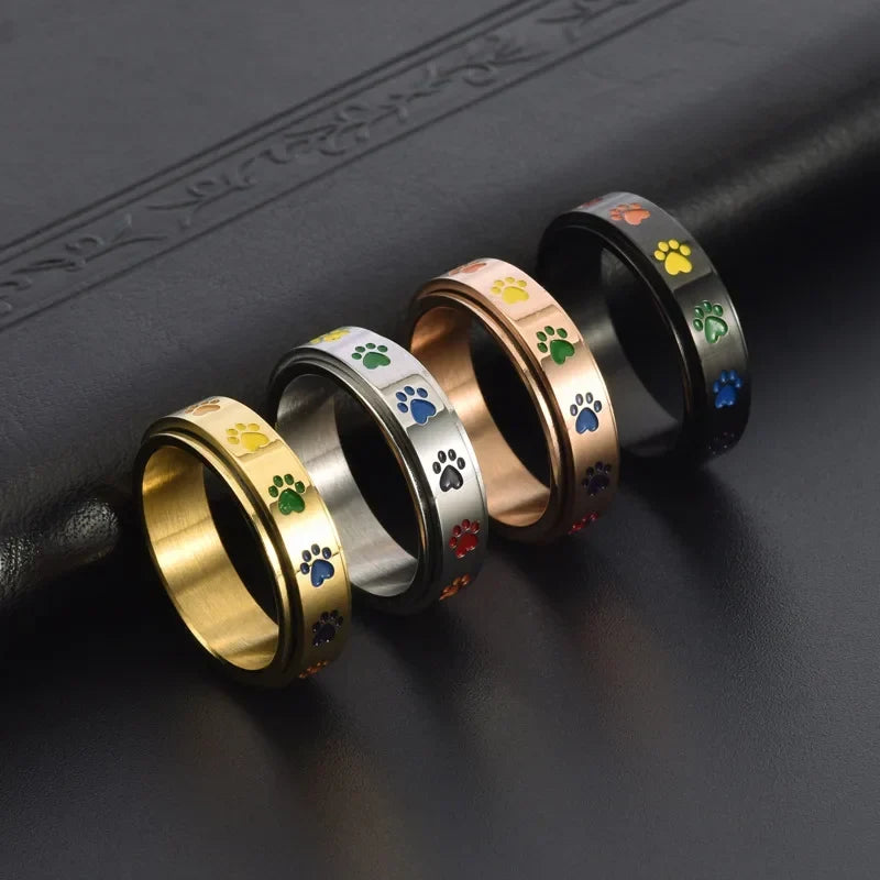 Drehbarer Anti-Stress Pfoten-Ring – Edelstahl mit Regenbogen-Pfoten