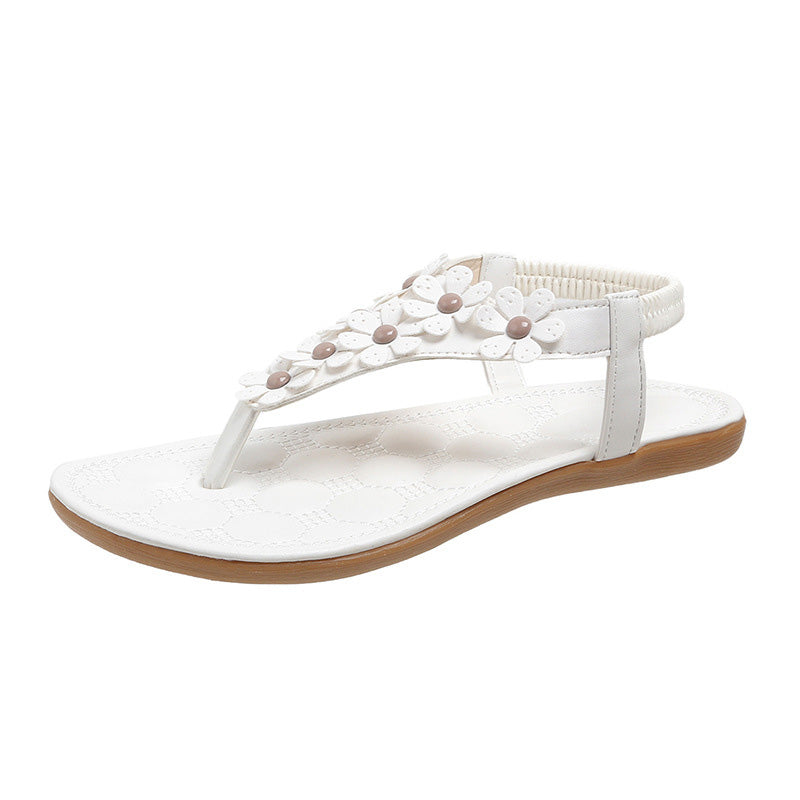 Sandalen mit Blumendetail – Eleganter T-Steg mit dekorativen Blüten