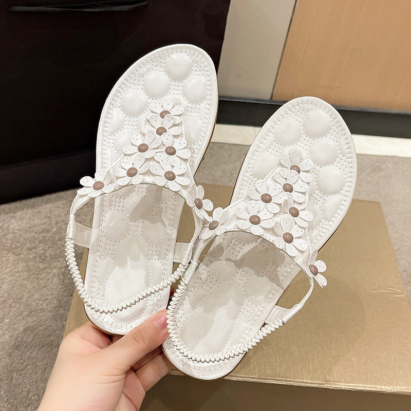 Sandalen mit Blumendetail – Eleganter T-Steg mit dekorativen Blüten