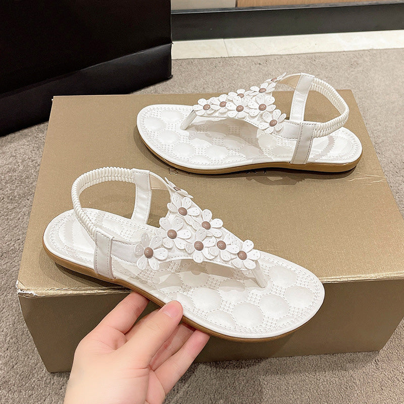 Sandalen mit Blumendetail – Eleganter T-Steg mit dekorativen Blüten