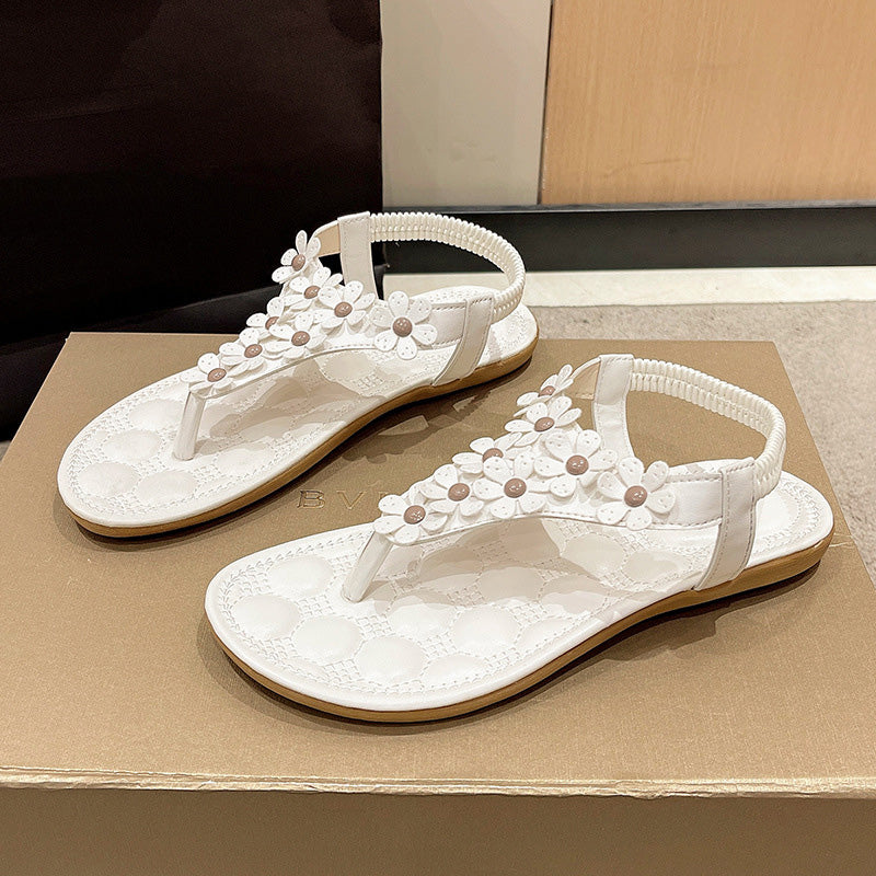 Sandalen mit Blumendetail – Eleganter T-Steg mit dekorativen Blüten
