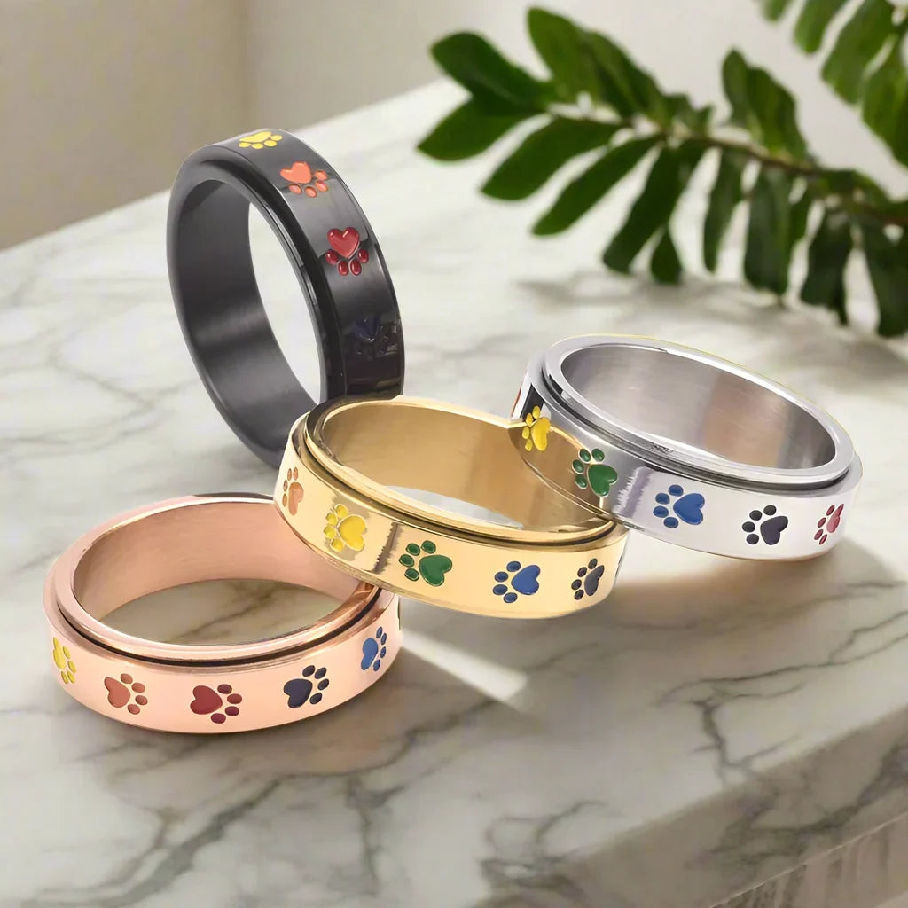 Drehbarer Anti-Stress Pfoten-Ring – Edelstahl mit Regenbogen-Pfoten