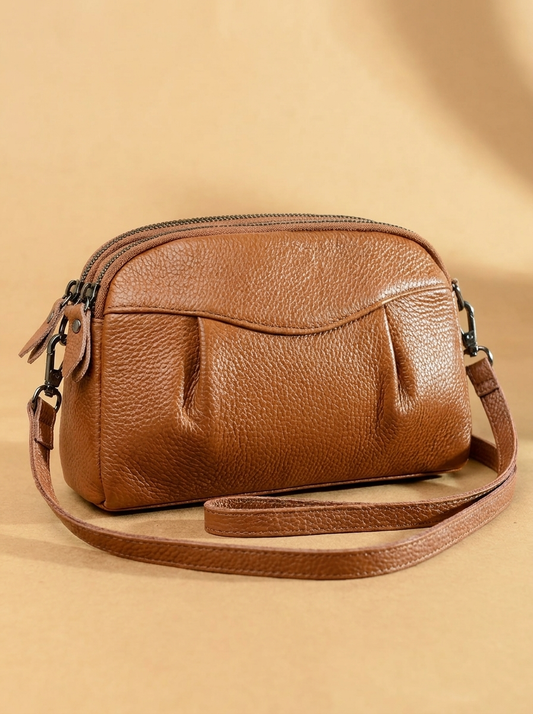 Finbjørg | Kleine und vielseitige Tasche in goldenem Cognac-Ton