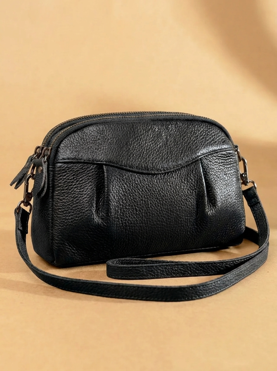 Finbjørg | Kleine und vielseitige Tasche in goldenem Cognac-Ton