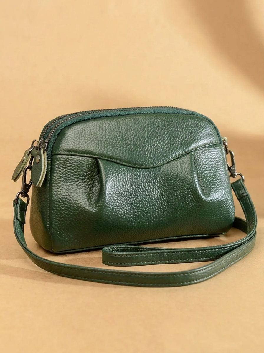 Finbjørg | Kleine und vielseitige Tasche in goldenem Cognac-Ton