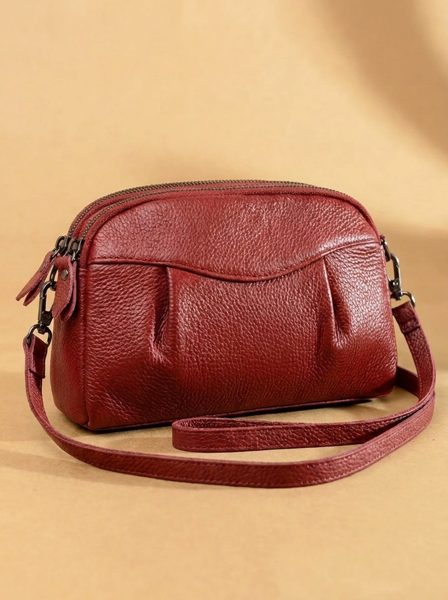 Finbjørg | Kleine und vielseitige Tasche in goldenem Cognac-Ton